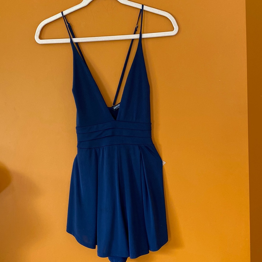 Beautiful ladies dark purple/blue romper made by Fashion Nova. Size XS.